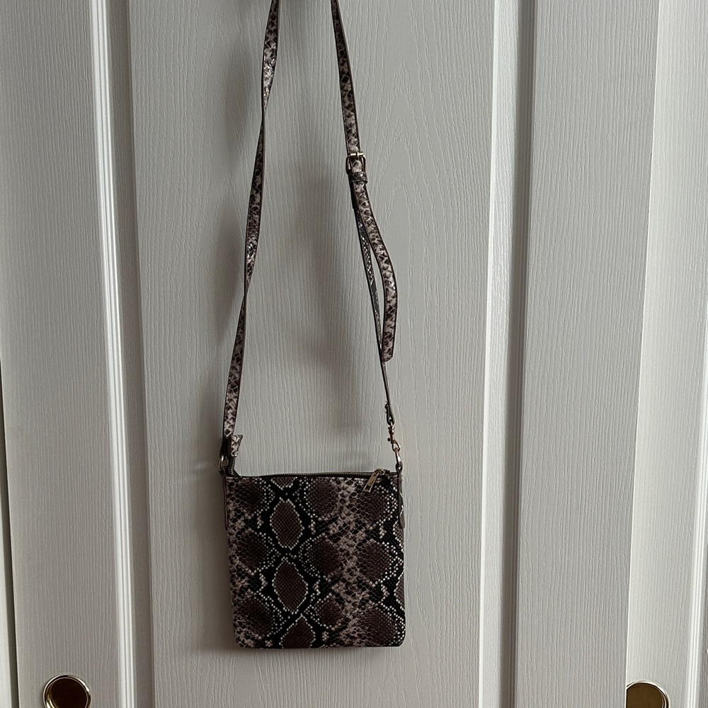 Crossbody purse   Fun snake print side pocket for your phone. Snap closure